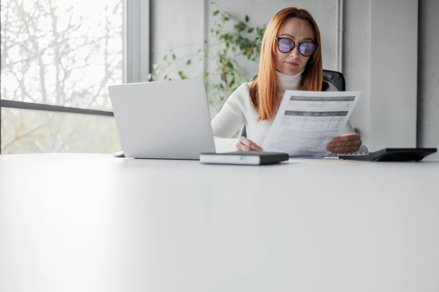Limited-company incorporation and client contract paperwork on a desk