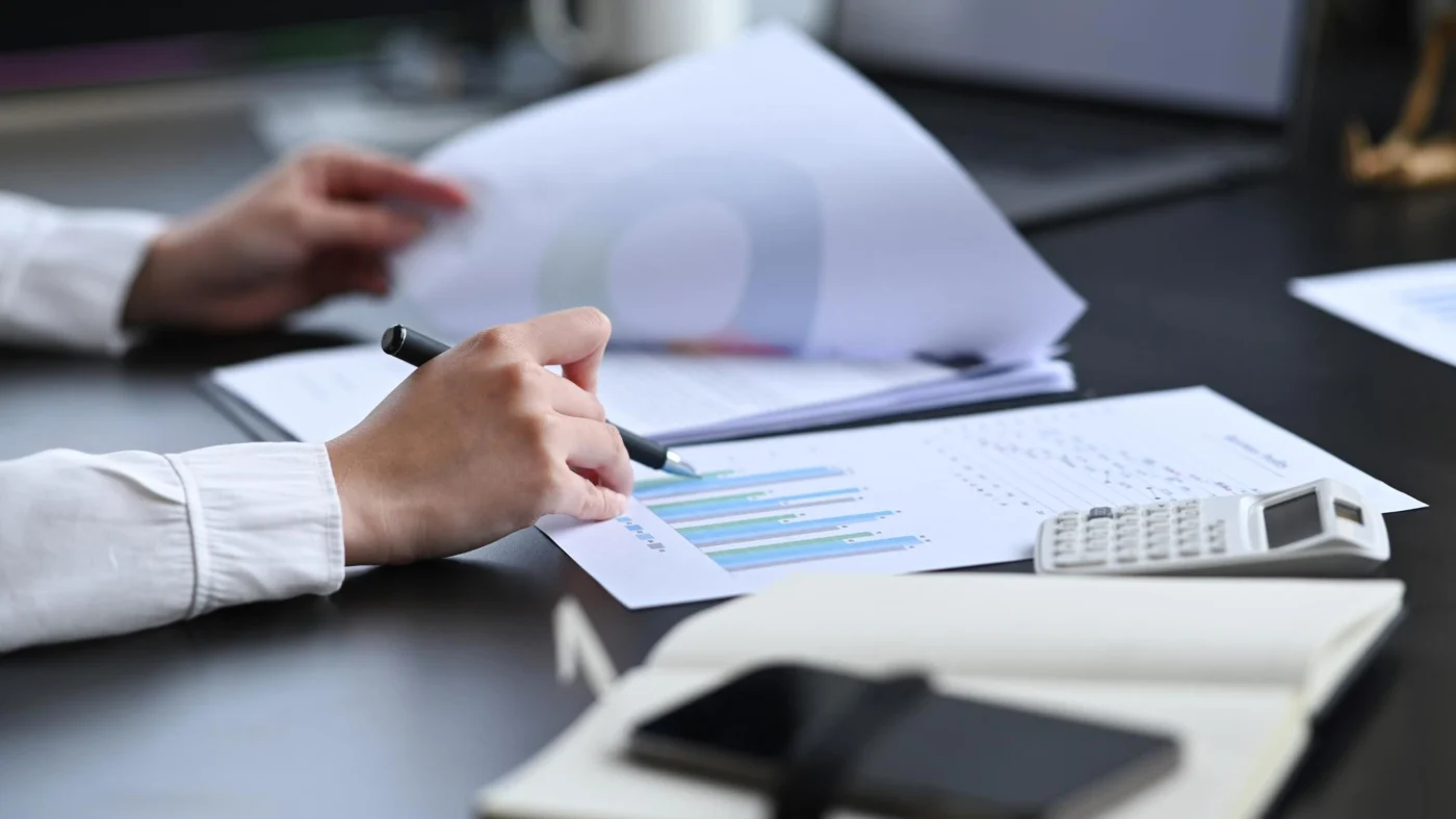 An independent professional preparing an invoice against agreed payment terms