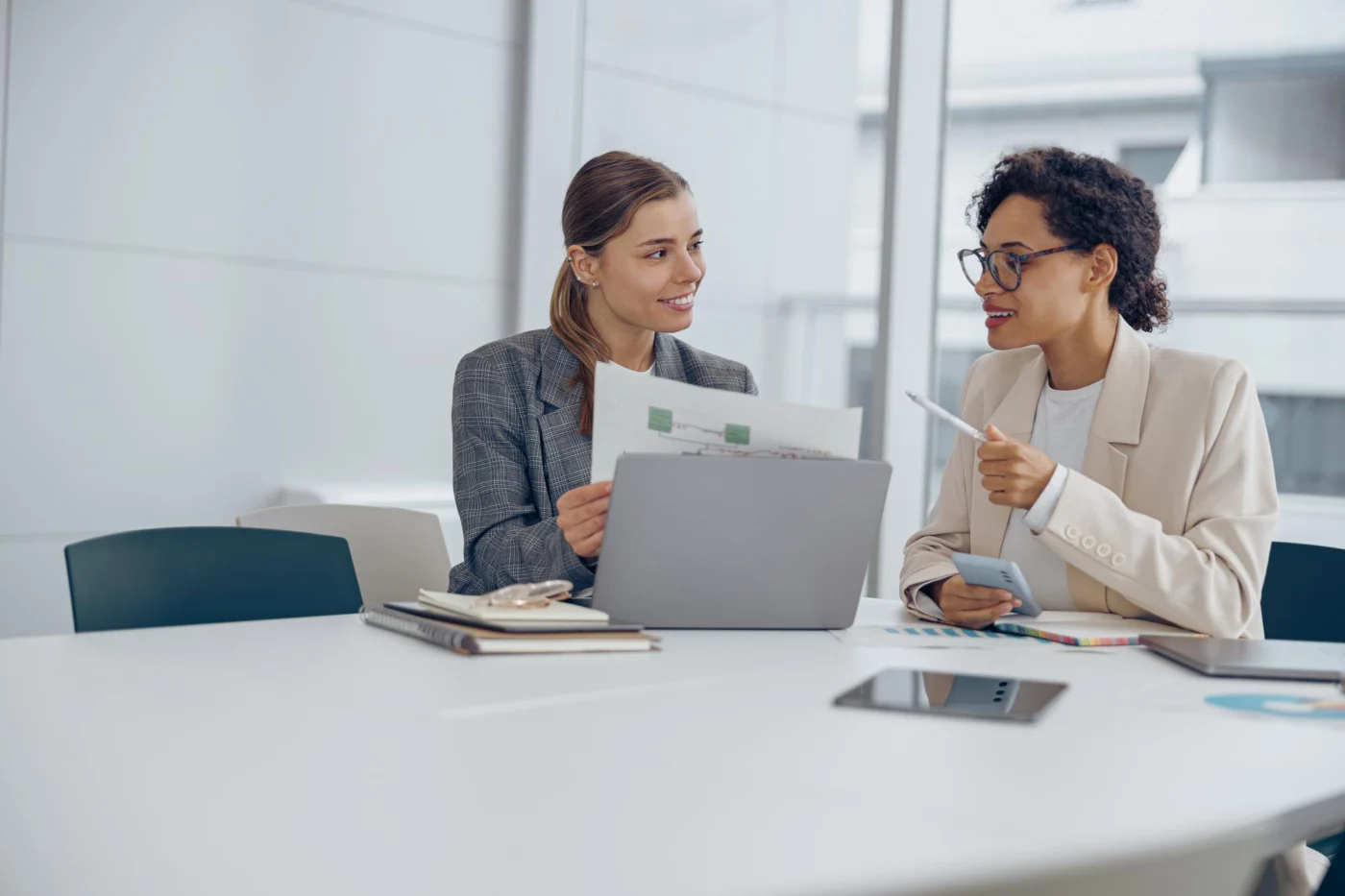 A two-person business-to-business meeting between a company and an external contractor