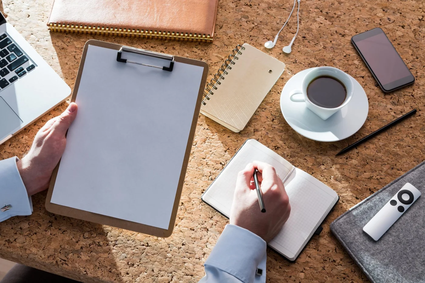 Handover documentation and notes laid out on a desk