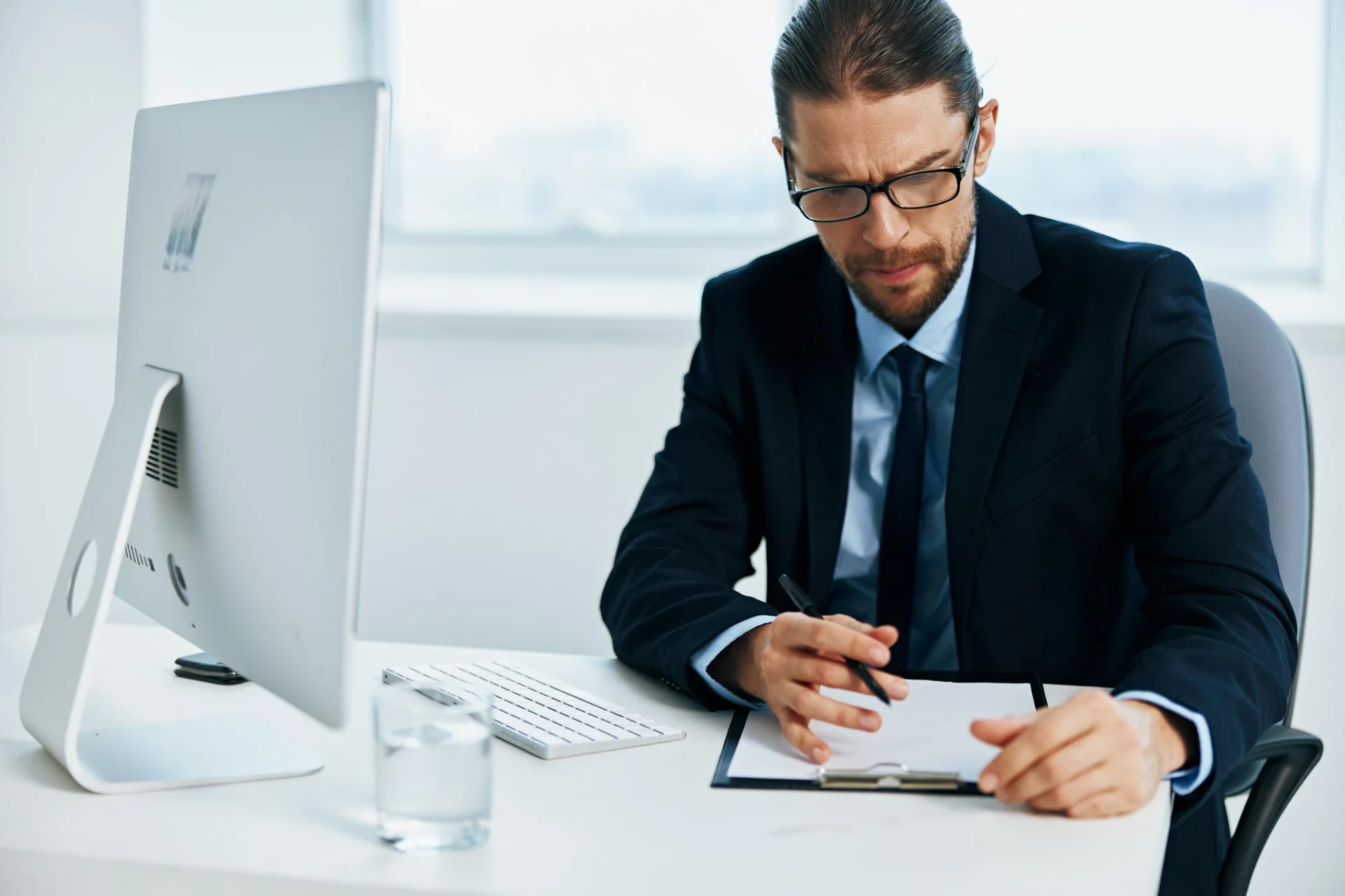 An independent professional reviewing a client services agreement at a desk